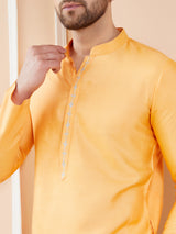 Peach Orange Chanderi Silk Straight Kurta with Embroidered Neckline & Pyjama